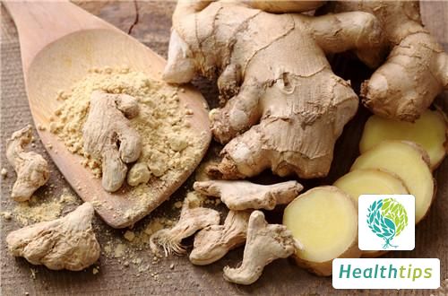 What are the benefits of applying warmed ginger to a babys feet?