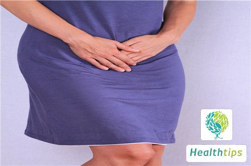 What are the possible reasons for white discharge after a woman urinates?